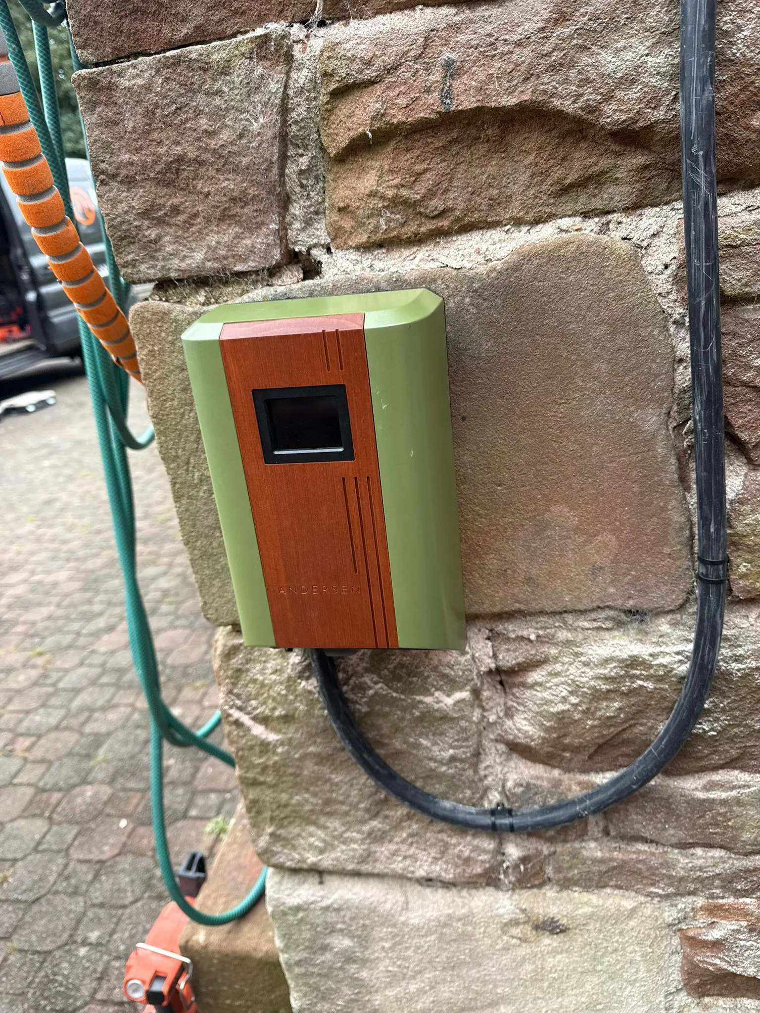 Andersen A2 EV charger installation on a natural stone pillar by Thomson Electrical & Energy Solutions Ltd